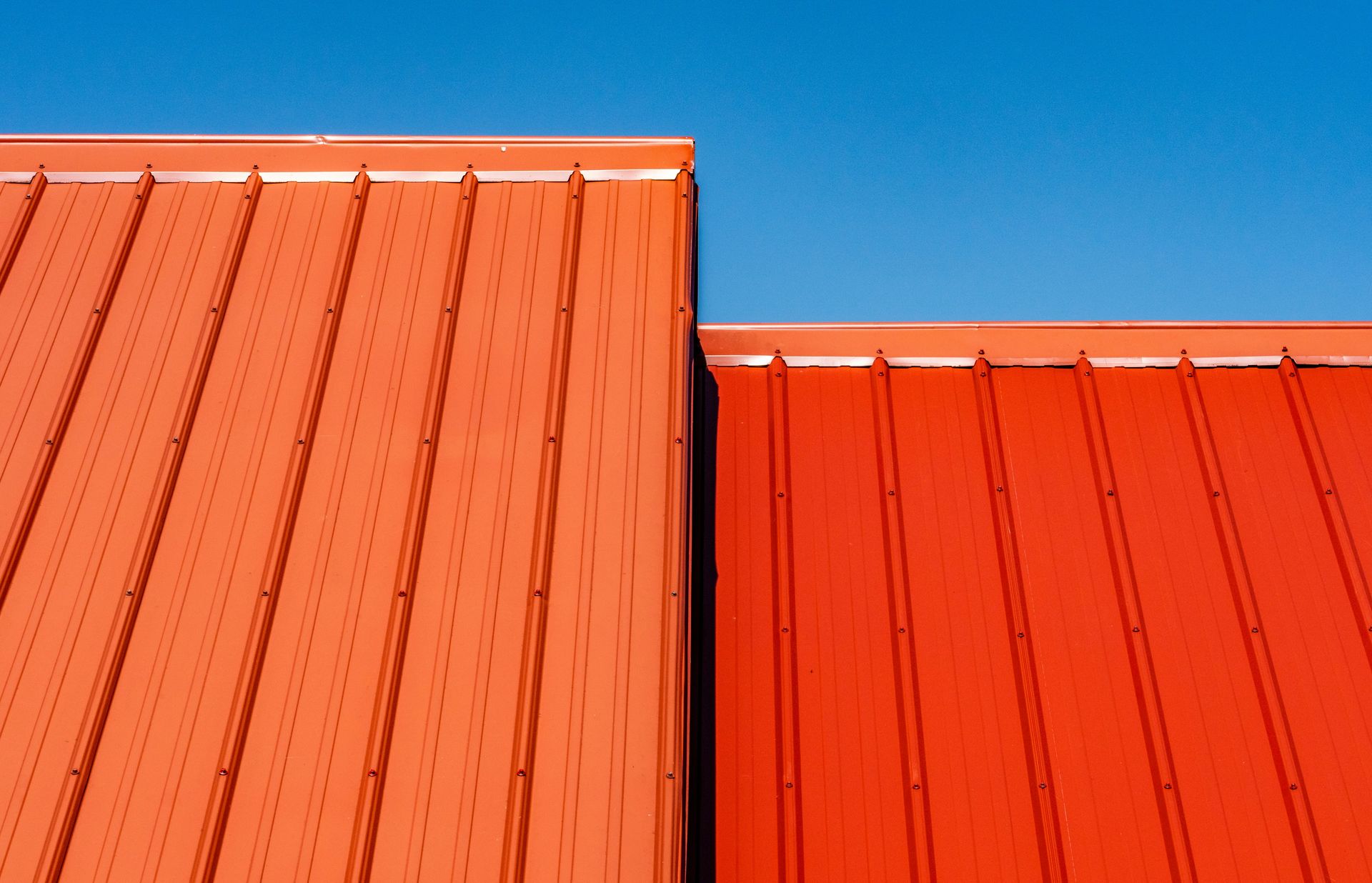 brown wooden wall under blue sky during daytime